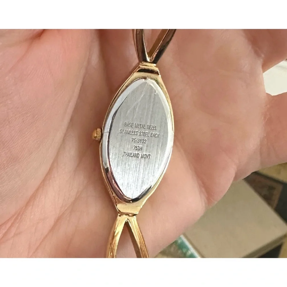 Armitron Now women's,gold-tone oval case with crystal accents and a two-tone